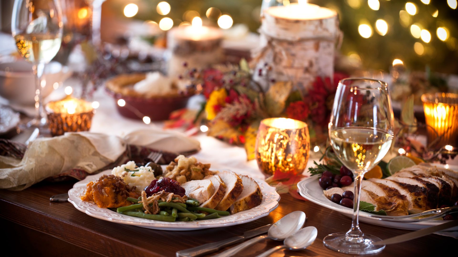 christmas dinner on a table with a glass of wine